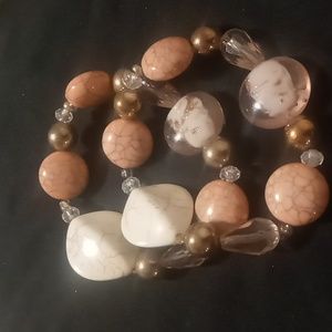 Glass and resin beaded salmon color off white & gold tone expandable bracelet